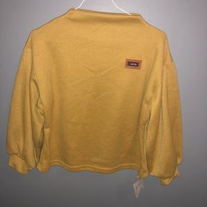 yellow sweater